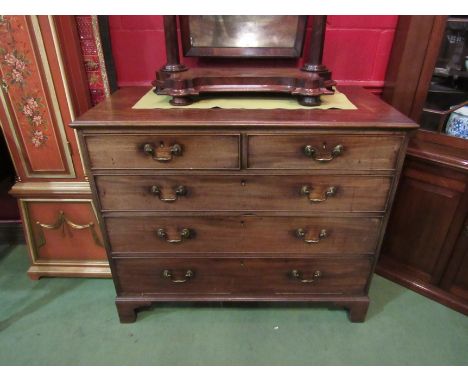 A George III mahogany chest of two short over three graduating long drawers, brass swan neck handles, bracket feet