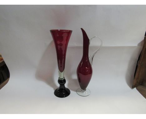 A ruby and black glass trumpet form vase, 38cm tall and a ruby and clear glass ewer, 40cm tall (2)