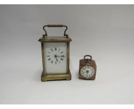 A small Art Deco clock of square form and a carriage clock