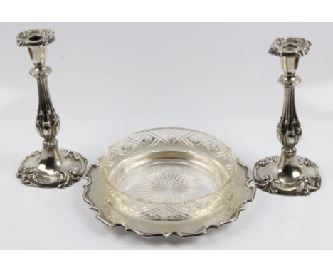 A pair of silver plated scrolling design candlesticks, height approx. 26cm, together with a silver plated Walker &amp; Hall s