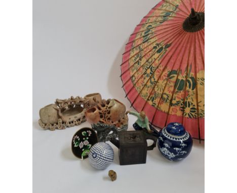 A selection of various oriental items to include umbrella, blue and white ginger jar, enamel dish, soapstone sculptures, etc.