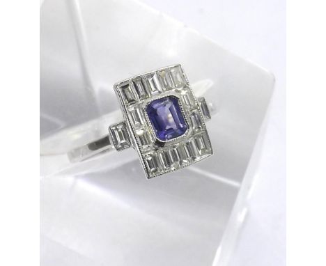 Art Deco style sapphire and diamond 18ct white gold cluster ring, the central sapphire in a surround of baguette-cut diamond,