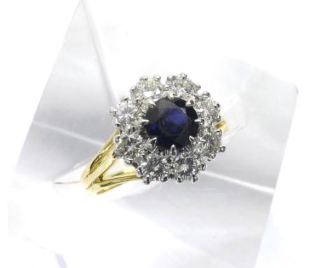 (830 1000162-1-a) 18ct sapphire and diamond cluster ring, the sapphire in a surround of eight round brilliant-cut diamonds, c