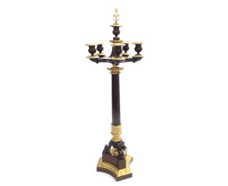 French Empire style ormolu and bronze five branch candelabra, upon a Corinthian column and triform plateau, 29" high