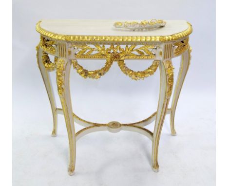 Attractive carved giltwood and painted console table, the serpentine top with darted borders over a frieze carved with wheats