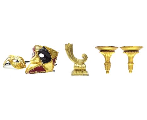 Antique giltwood cornucopia candlestick, 9" high; together with a pair of giltwood wall brackets and two of Venetian masks (5