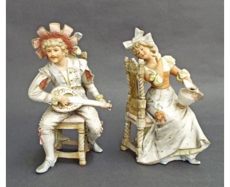 Pair of Continental seated bisque figures of a gentleman playing a mandolin serenading his lady, 10" high (at fault)  