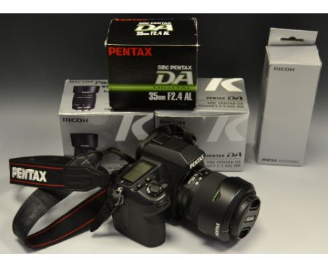 A Pentax K-5 II digital camera, 4475 shutter count; a Pentax 50mm 1.8; other Pentax lenses including 35mm F2.4, 18-55MM f3.5-