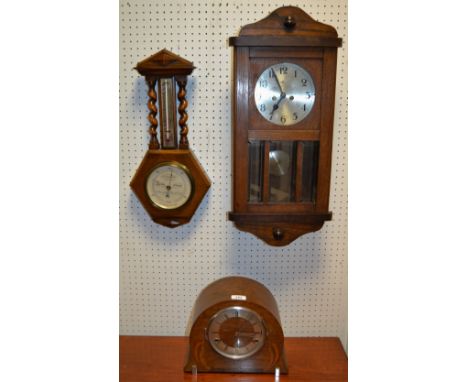 An oak cased wall clock with silvered dial; a walnut and marquetry mantel clock; a wall hanging barometer (3) 