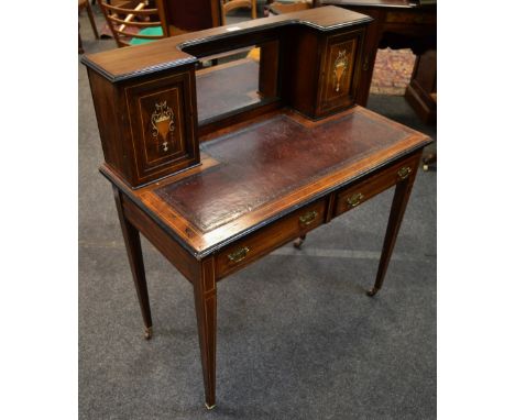 A rosewood bonheure du jour, the gallery with mirror flanked by trophy inlaid cupboards, leather writing surface, two short d