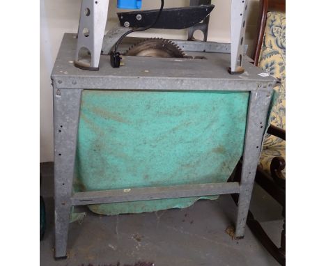 A galvanized metal framed saw bench