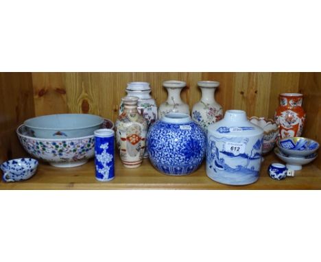 A shelf of Satsuma vases, Oriental bowls etc