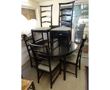 A 1990s circular dining table in black ash, together with 2 spare leaves, and a set of 6 matching black lacquered ladder-back