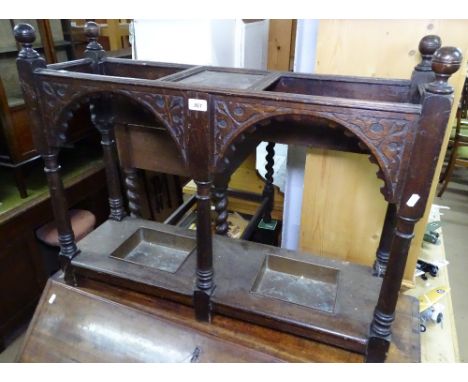 A carved oak double stick / umbrella stand, W88cm