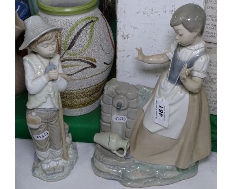 A large Nao figure of a girl and another
