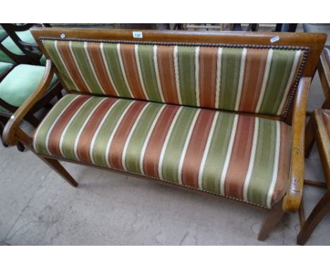 A 1920s oak hall bench with stripped upholstery, L116cm