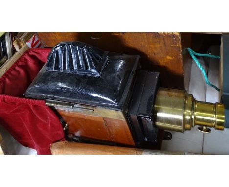 An Edwardian mahogany and brass magic lantern, with original case