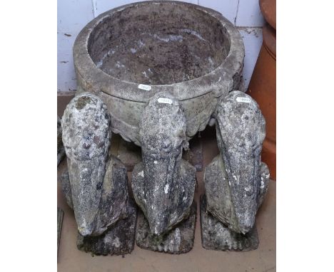 A weathered concrete garden planter, and 3 weathered concrete garden pelican figures