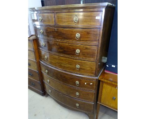 A George III mahogany and satinwood strung bow-front chest on chest, brass ring drop handles, on bracket feet, W115cm