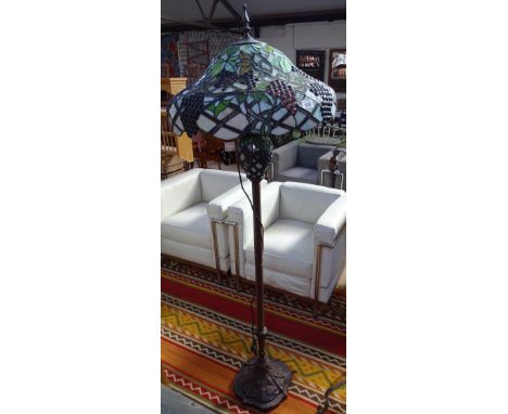 A Tiffany style standard lamp, with grape design lead light shade