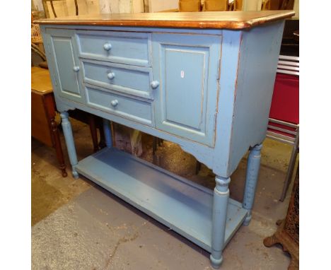 A painted and polished cabinet, with fitted drawers and cupboards and shelf below, W 130cm