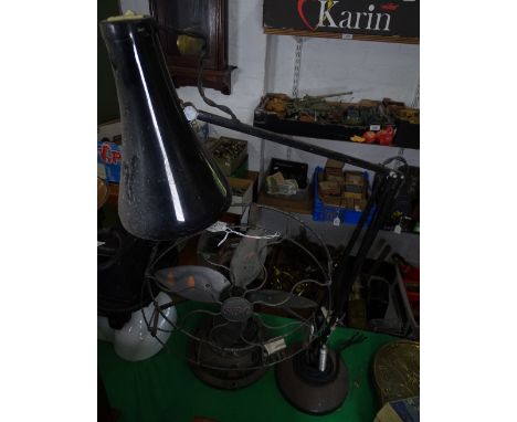 A black angle-poise table lamp, and a GEC fan