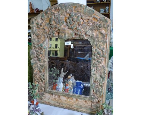 A wall mirror by Alan Wallis Designs, height 26"