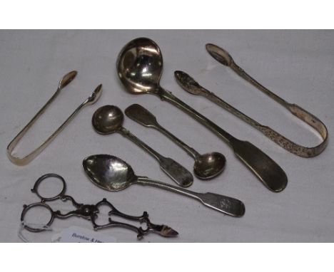 A quantity of silver spoons, sugar nips and ladle, 4.9oz