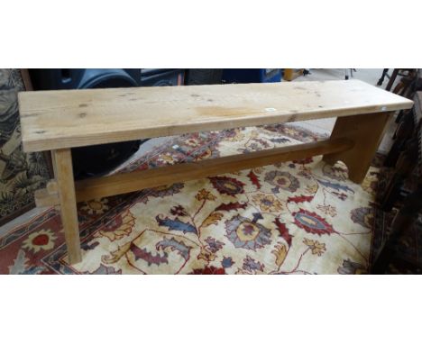A polished pine bench, L152cm
