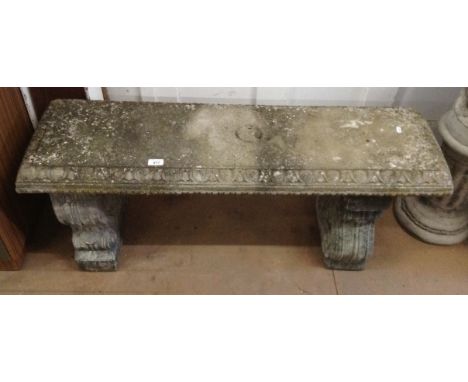 A weathered concrete 3-section garden bench, L112cm