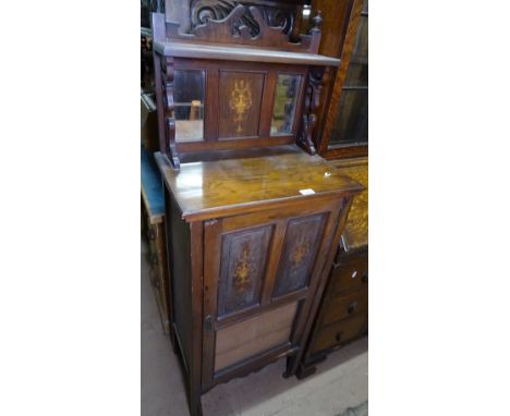 An Edwardian walnut music cabinet, with raised back and panel door, W 53cm