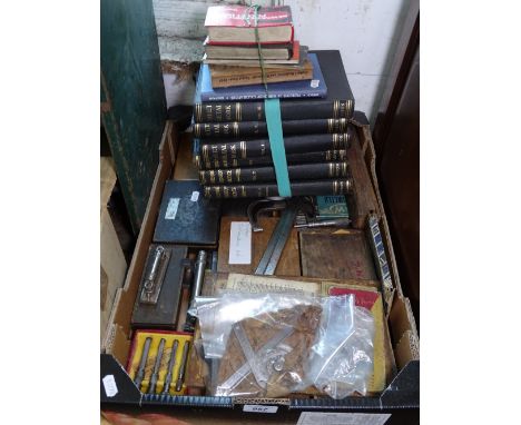 A tray of engineering tools and engineering books