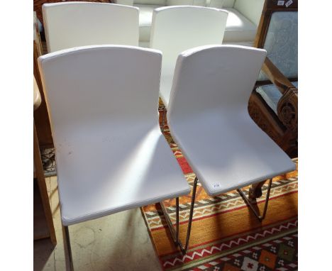 A set of 4 white leather dining chairs on chrome sled bases, by "Bernahrd" retailed by Ikea dated 1999, labels to the undersi