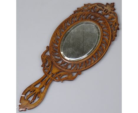 A Sorento ware hand mirror with pierced surround