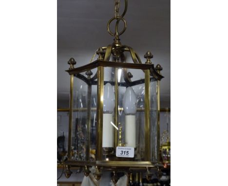 A brass frame 3-light Georgian style hall lantern