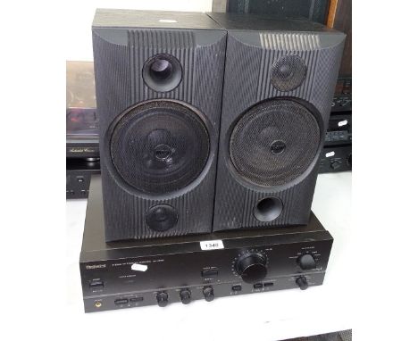 A Technics integrated amplifier, and a pair of B&amp;W speakers