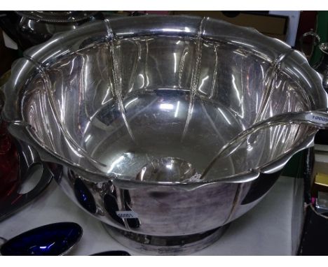 A large silver plated punch bowl and ladle by Walker &amp; Hall