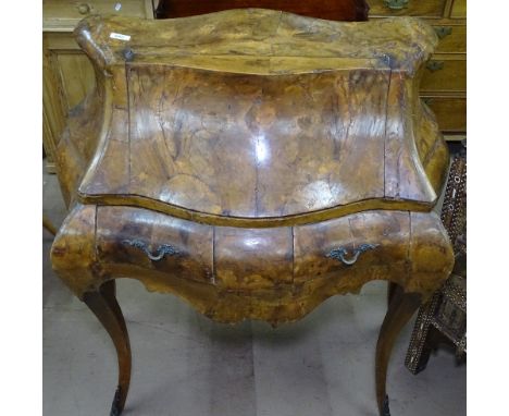 A 1950s Italian Baroque revival olivewood bombe bureau de dame, the rising front revealing drawers, pigeon holes and mirror w