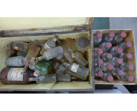 Apothecary bottles and a tin trunk