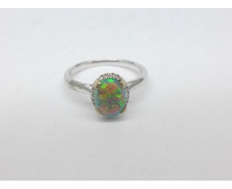 An 18ct gold, diamond and opal ring, 3g, N