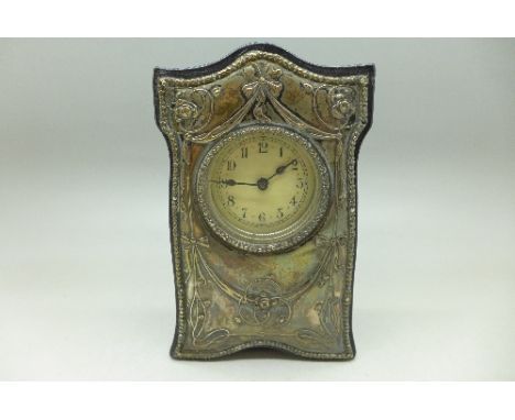 An Art Nouveau silver fronted clock, Birmingham 1911, Boots Pure Drug Company, 14.5cm