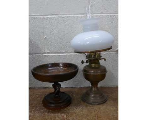 An oak comport and an oil lamp