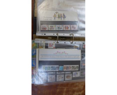 An album of mint issue stamps and first day covers