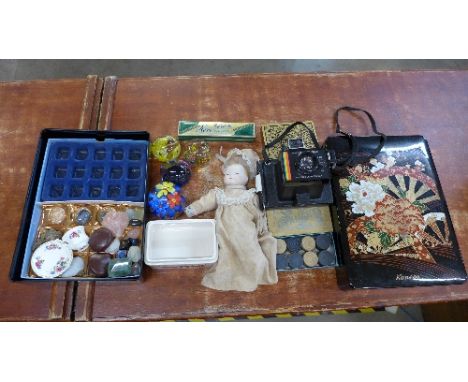 A doll, draughts, paperweights including Caithness, miniature Royal Albert Poppy pattern cup and saucer, a Polaroid Super col