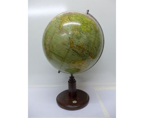 An early 20th Century globe, the stand with compass