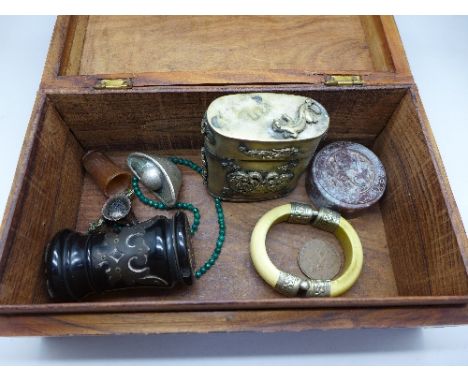 A Chinese seal, an ebony pot, a metal box decorated with dragons, a bangle, a malachite necklace, a brass mounted box, etc.