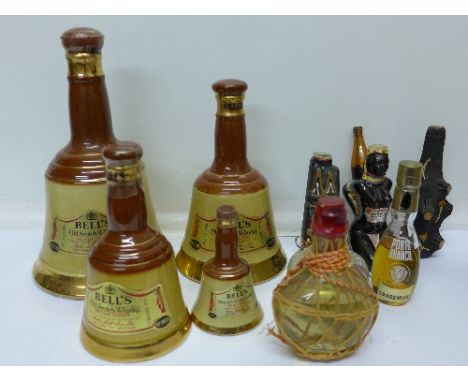 Four graduated Wade Bell's Scotch whisky decanters with contents and a collection of spirit miniatures