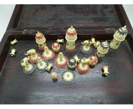 A part chess set with bone pieces, and bone inlay to chessboard