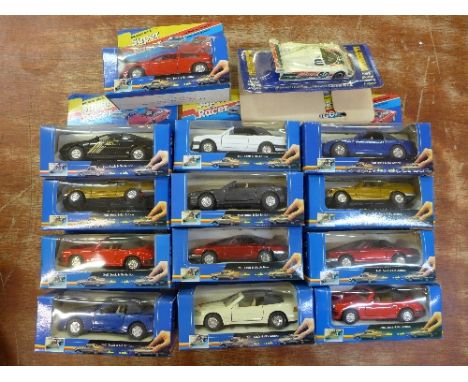 Fourteen die-cast model vehicles, including a Corgi Castrol GTX Jaguar racing car