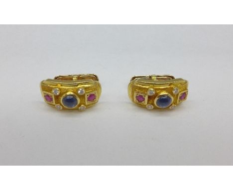 A pair of 18ct gold, sapphire, ruby and diamond cufflinks, 12.8g